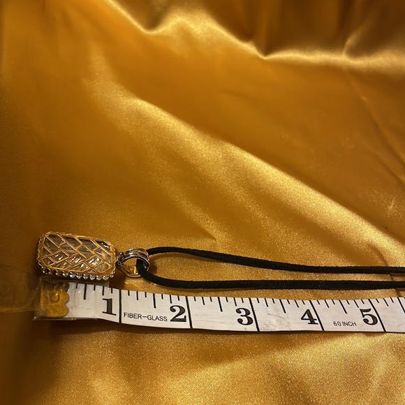 Gold and silver colored pendant on leather like cord strap - Picture 10 of 12
